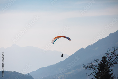 paraglider in the sky, alps