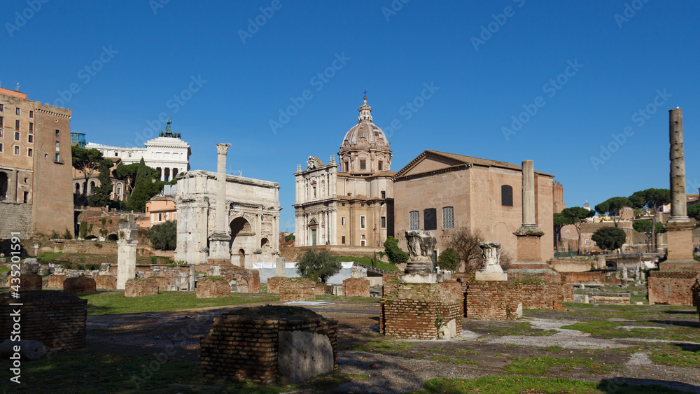 Ruins of the Roman Forum. View of the Basilica Julia with Santi Luca e Martin in the background