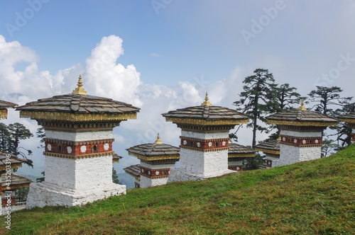 Landscape view of memorial chortens on sky background at Dochula pass in the Bhutan Himalaya photo