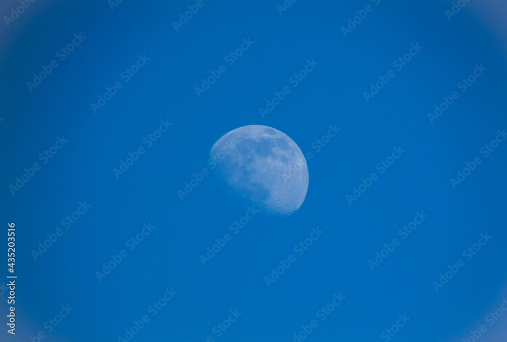 moon centered close-up against blue sky moon centered close-up against blue sky