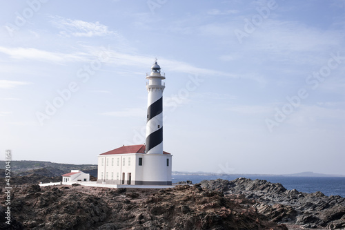 lighthouse on the edge of a cliff protecting the ships of the Mediterranean