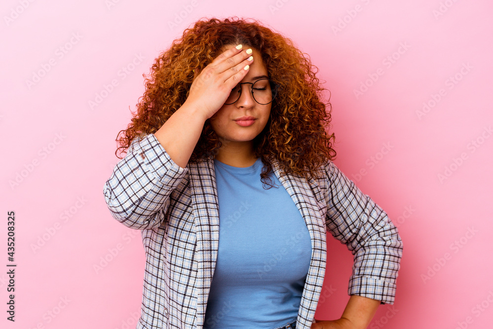 Young latin curvy woman isolated on pink background having a head ache, touching front of the face. Young latin curvy woman isolated on pink background having a head ache, touching front of the face.