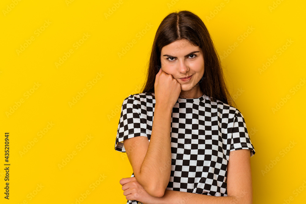 Young caucasian woman isolated on yellow background who feels sad and pensive, looking at copy space. Young caucasian woman isolated on yellow background who feels sad and pensive, looking at copy space.