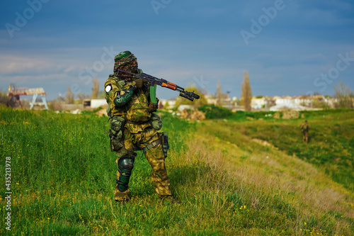 Russian soldier in military uniform holding a weapon in his hands
