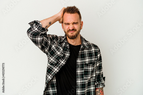 Fényképezés Young tattooed caucasian man isolated on white background forgetting something, slapping forehead with palm and closing eyes