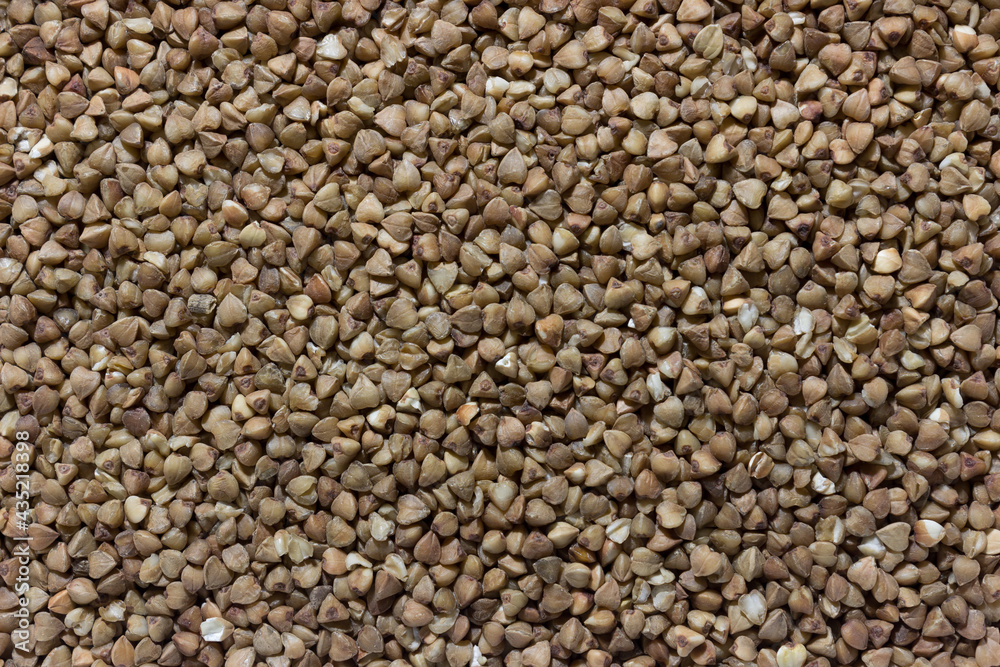 Buckwheat groats background. . Raw buckwheat cereal texture. Buckwheat groats background. . Raw buckwheat cereal texture.