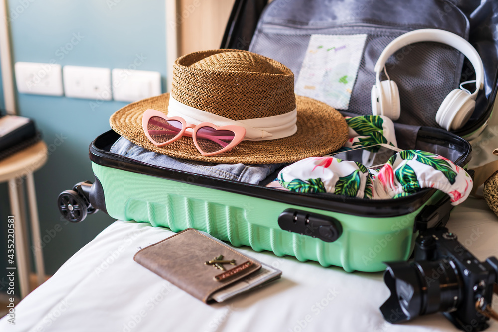 Traveler suitcase and luggage with travel accessories and items preparing  for travel Stock-Foto | Adobe Stock