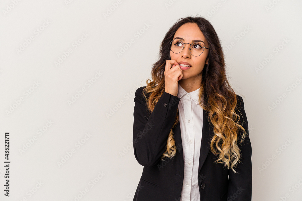 Young mexican business woman isolated on white background relaxed thinking about something looking at a copy space. Young mexican business woman isolated on white background relaxed thinking about something looking at a copy space.