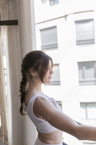 Athlete woman looking out the window
