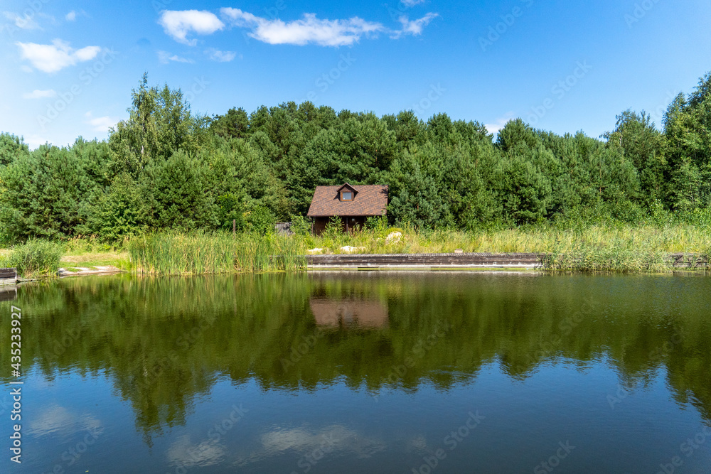 lonely house good weather in the forest near the lake