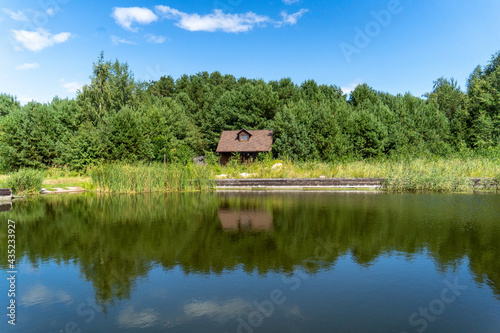 lonely house good weather in the forest near the lake © DMYTRO