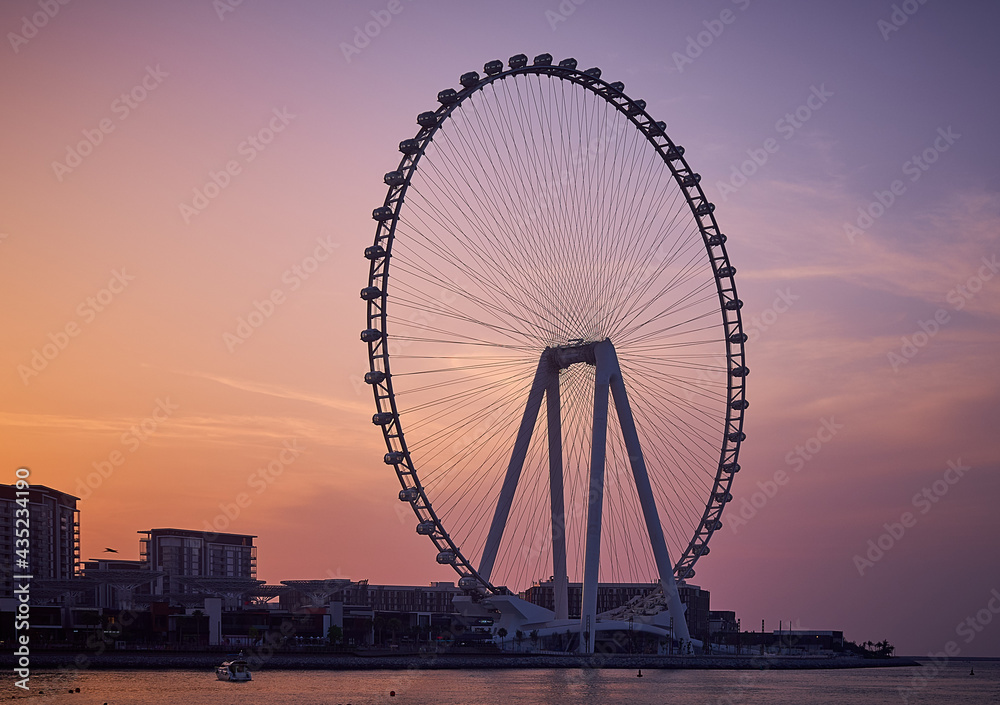 Ferris wheel stands on the coast of Dubai