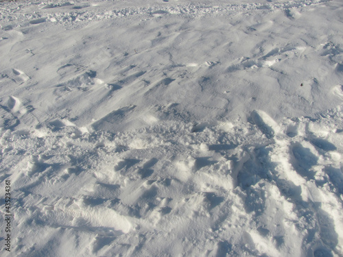 background: white snow with footprints