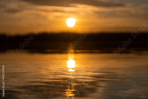 sunset over the river lake sea yellow and orange