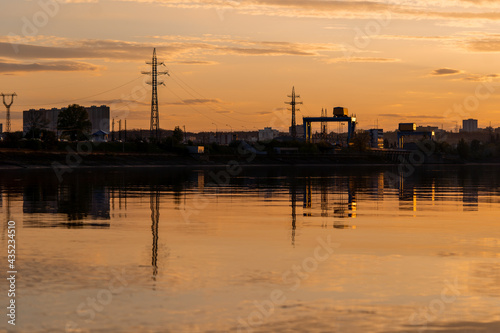 sunset over the city with still water and reflection