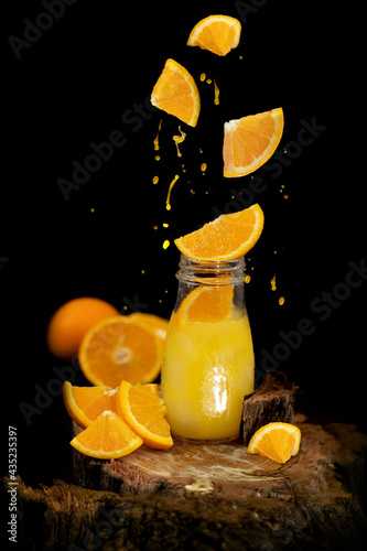 orange juice splash on black