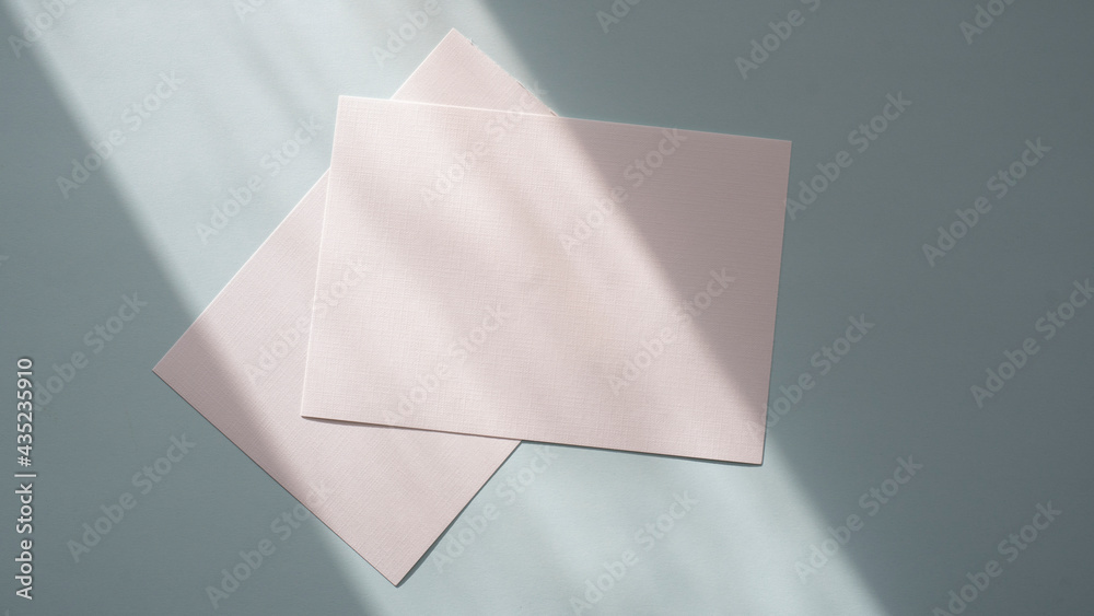White textured sheets of paper in sunlight. mockups White textured sheets of paper in sunlight. mockups