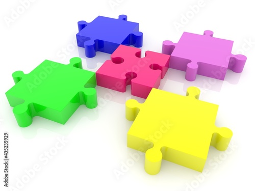 Pieces of puzzles of different colors and shapes on white