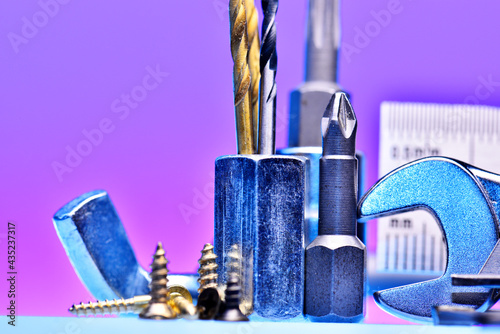 Konstfotografi set of tools and consumables for metal on a purple background.