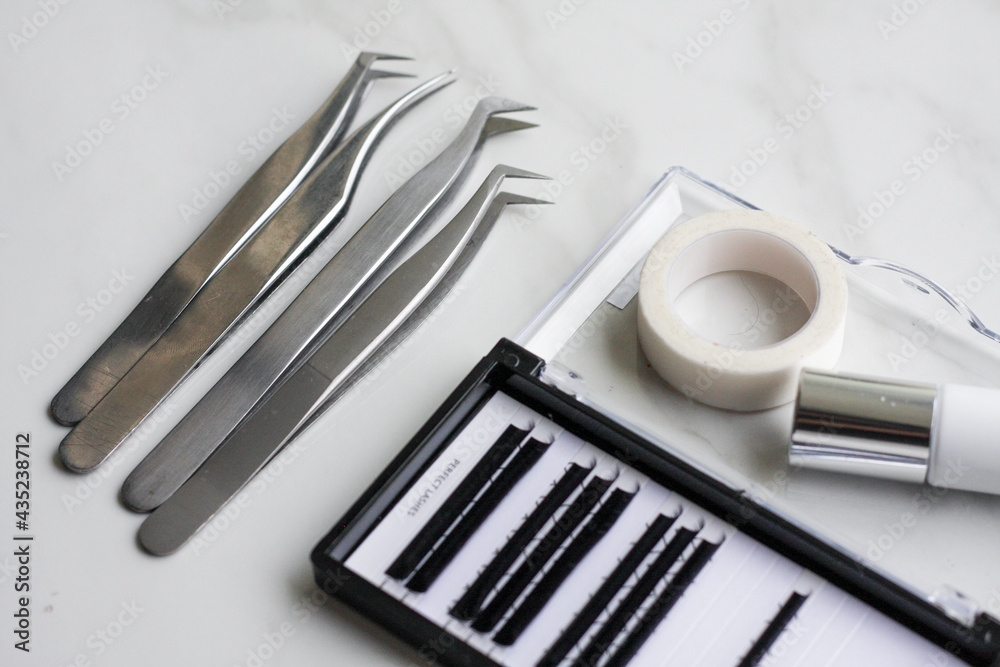 Lashmaker tools on white light background Lashmaker tools on white light background