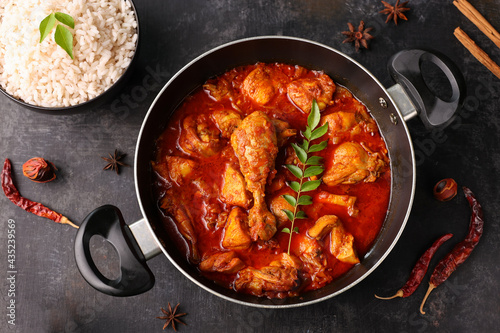 Spicy red Kerala chicken curry , rice Goan style chicken vindaloo. Butter chicken Murgh Makhani curry roast hot spicy gravy dish Dhaba Punjab, India. North Indian non-vegetarian cuisine Garam Masala. 