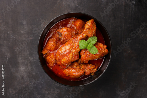 Spicy red chicken curry. Goan style chicken vindaloo. Butter chicken Murgh Makhani curry roast hot and spicy gravy dish Dhaba Punjab, India. North Indian non-vegetarian cuisine Garam Masala. tikka