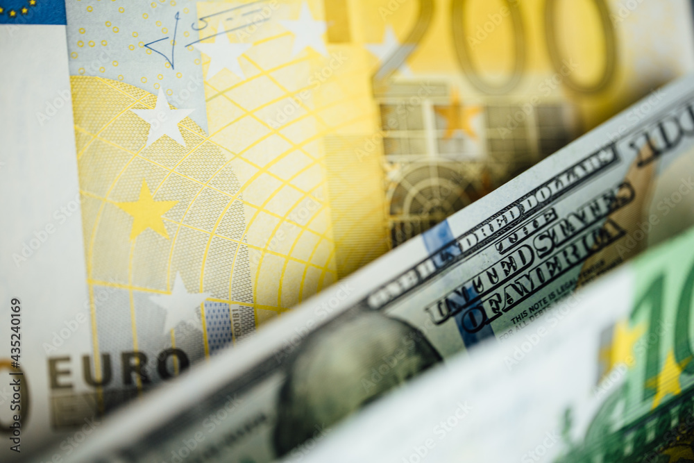 Fototapeta premium Money background. USA dollar with Euro Banknotes and Bitcoin cryptocurrency investing concept.