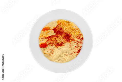 Traditional appetizer dishes "Humus" on a dinner plate. Top view