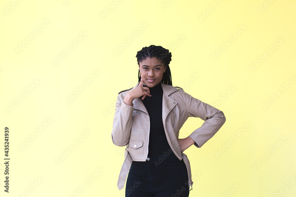 beautiful and thoughtful African American woman, on a yellow background beautiful and thoughtful African American woman, on a yellow background