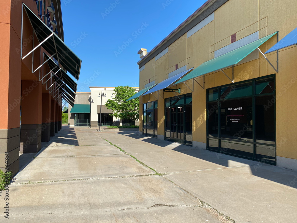 Abandoned stores at an outdoor dead outlet mall, clos