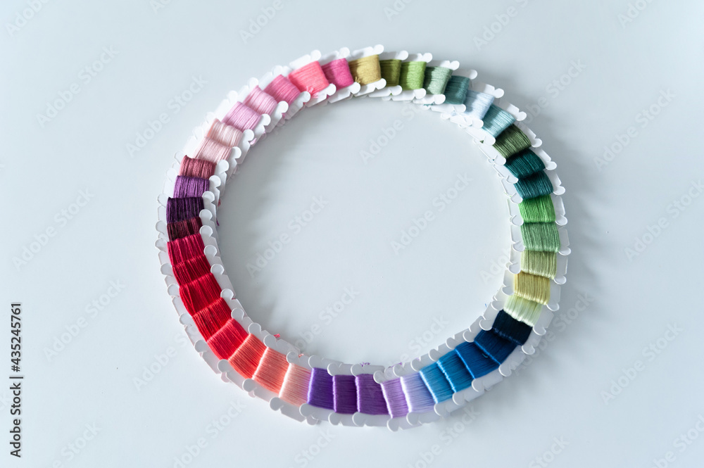 Word DIY world made of colorful bobbins, treads. Do it yourself concept. Sewing, hobby