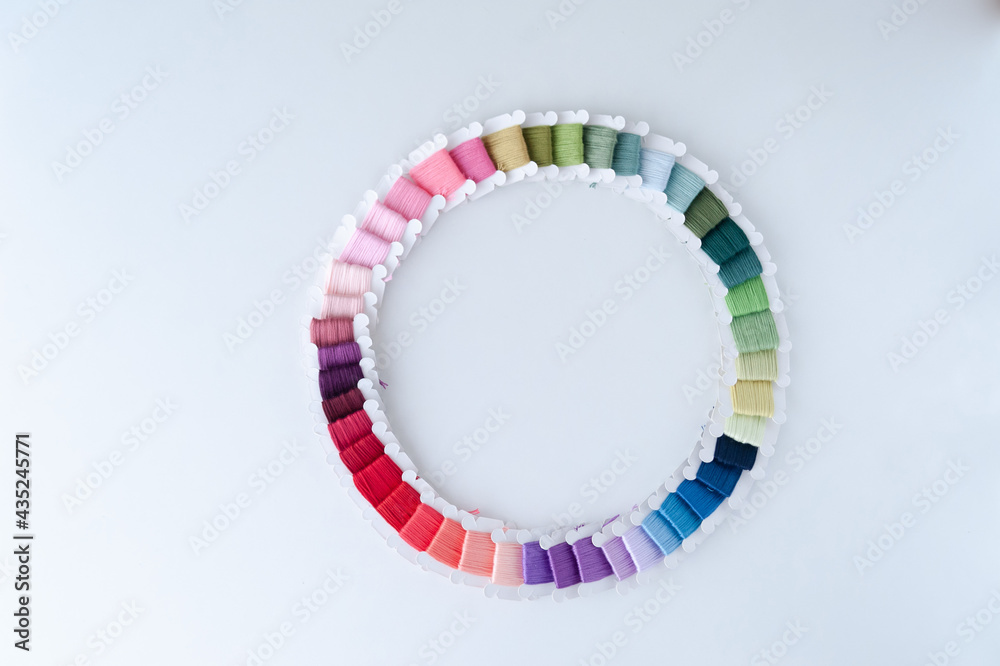 Word DIY world made of colorful bobbins, treads. Do it yourself concept. Sewing, hobby