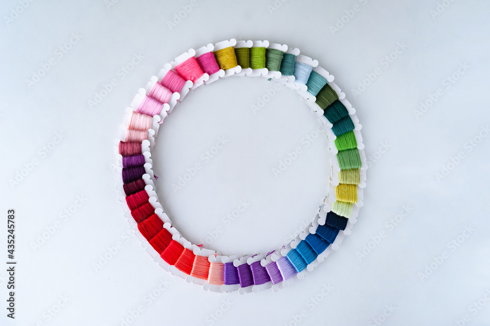 Word DIY world made of colorful bobbins, treads. Do it yourself concept. Sewing, hobby