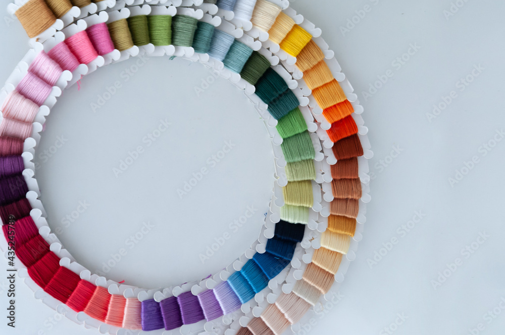 Word DIY world made of colorful bobbins, treads. Do it yourself concept. Sewing, hobby