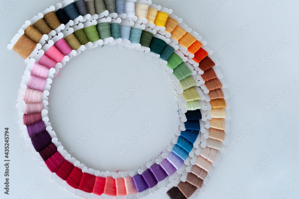 Word DIY world made of colorful bobbins, treads. Do it yourself concept. Sewing, hobby