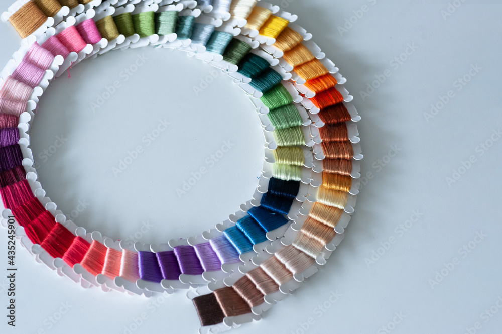 Word DIY world made of colorful bobbins, treads. Do it yourself concept. Sewing, hobby