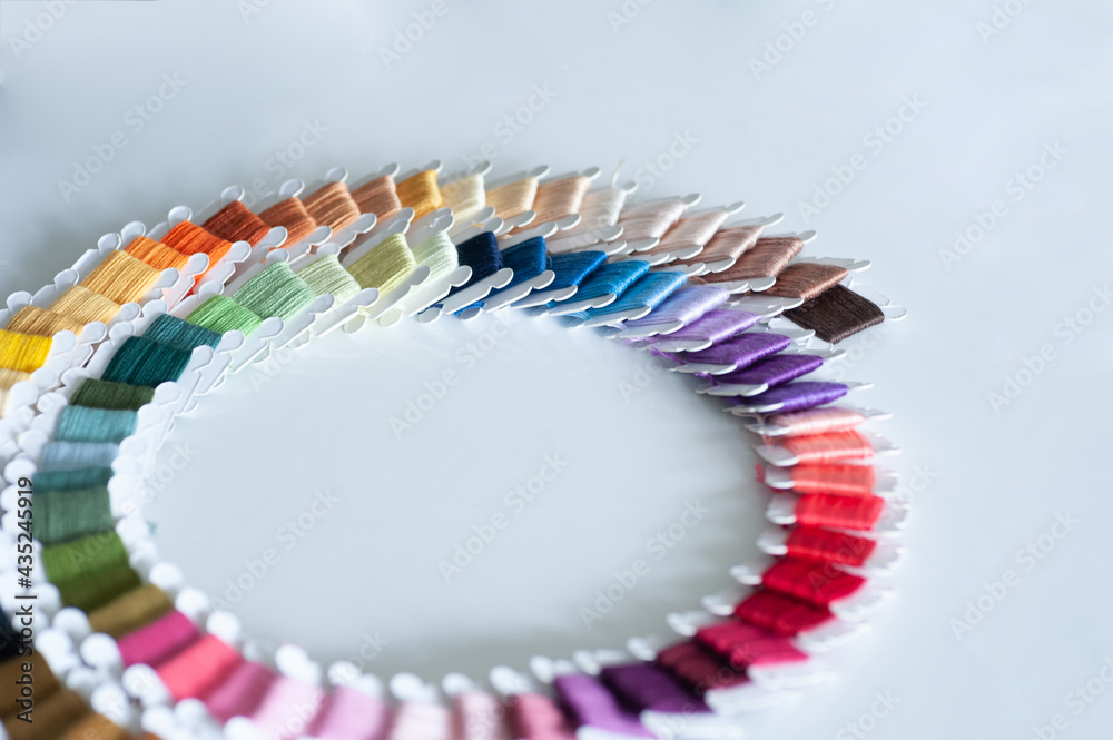 Word DIY world made of colorful bobbins, treads. Do it yourself concept. Sewing, hobby
