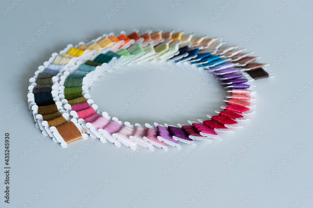 Word DIY world made of colorful bobbins, treads. Do it yourself concept. Sewing, hobby