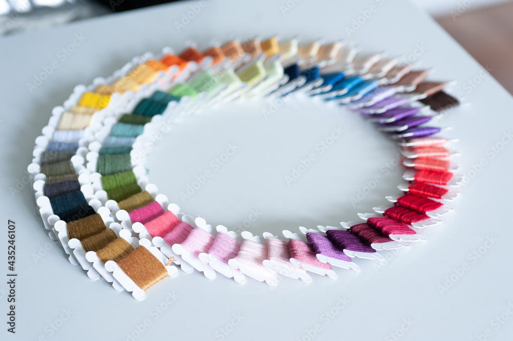 Word DIY world made of colorful bobbins, treads. Do it yourself concept. Sewing, hobby