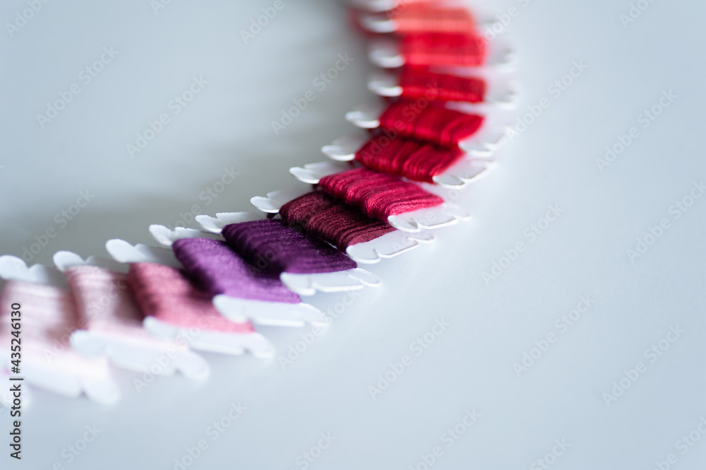 Word DIY world made of colorful bobbins, treads. Do it yourself concept. Sewing, hobby