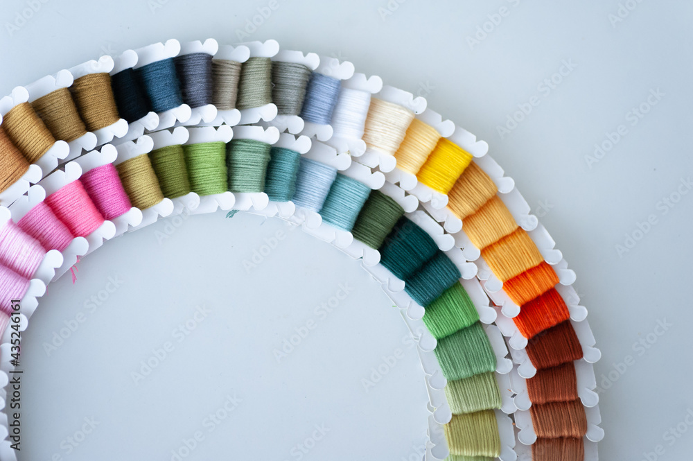 Word DIY world made of colorful bobbins, treads. Do it yourself concept. Sewing, hobby