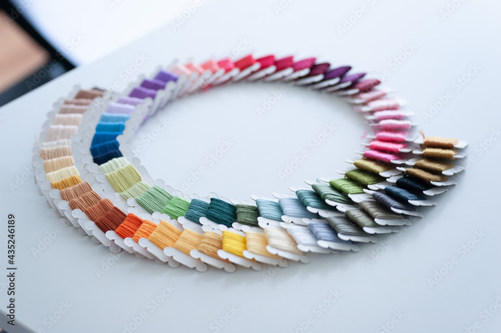 Word DIY world made of colorful bobbins, treads. Do it yourself concept. Sewing, hobby