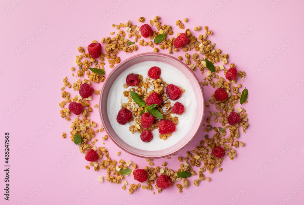 Bowl with greek yogurt, raspberries and granola. Top view flat lay. Healthy snack and nutrition breakfast. Bowl with greek yogurt, raspberries and granola. Top view flat lay. Healthy snack and nutrition breakfast.