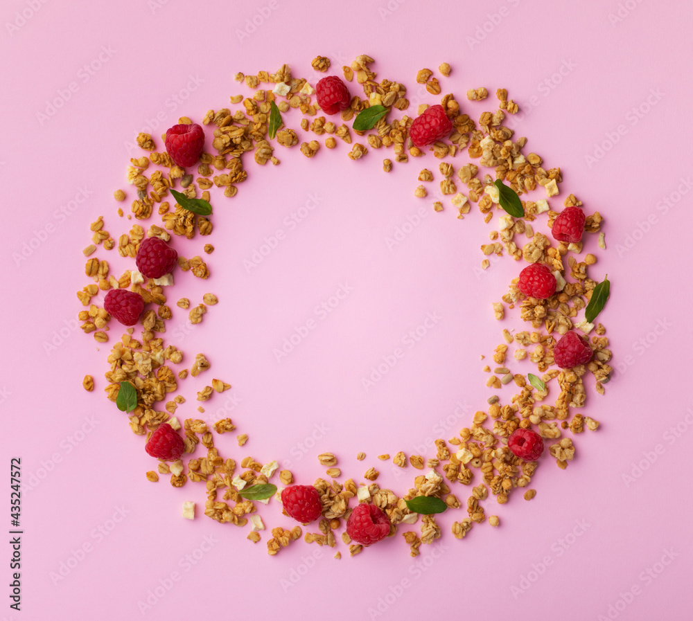Fresh raspberries and granola for healthy nutrition breakfast. Top view flat lay.