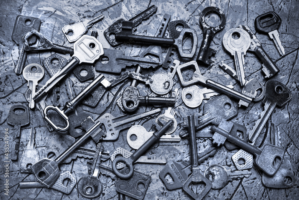 Fototapeta premium A composition of many old, rusty keys of different shapes.