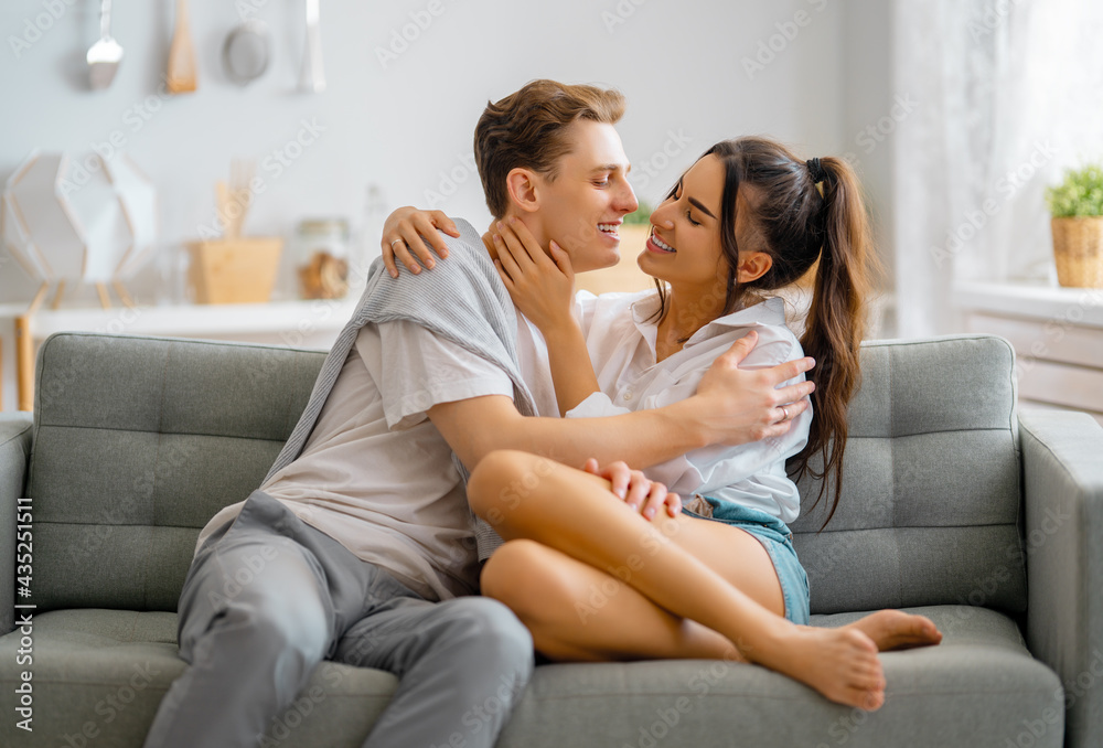 couple having fun and hugging at home.