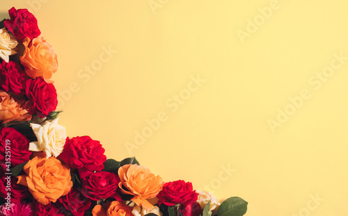 Wild roses lay down on yellow background  vintage flat lay romantic concept with copy space