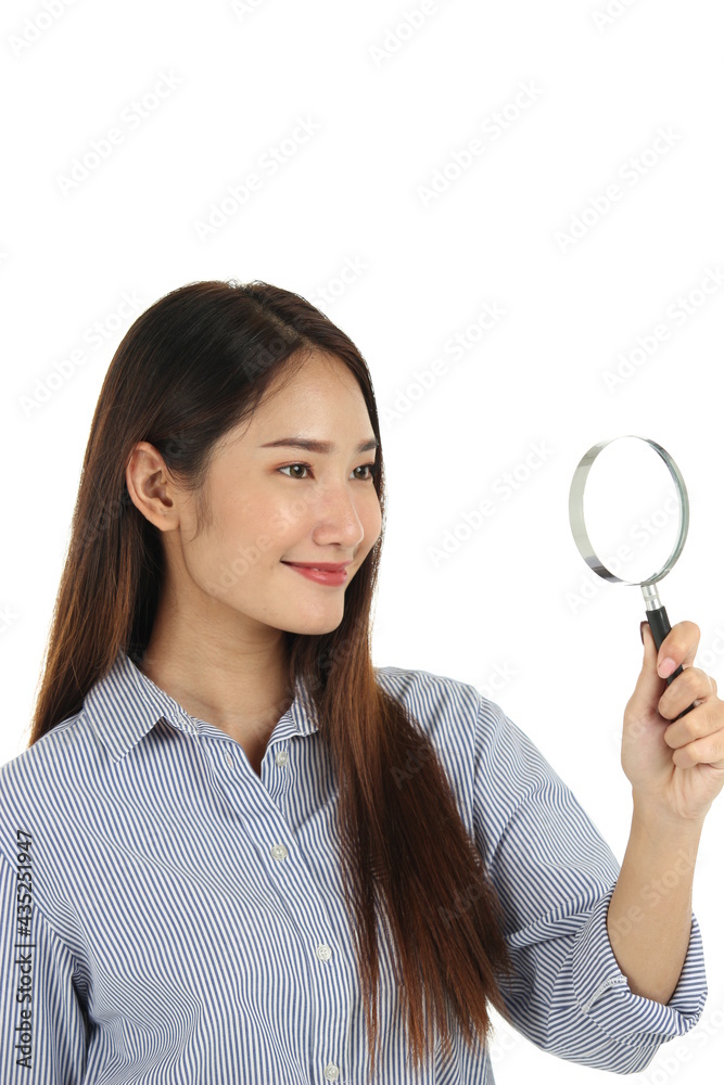Portrait of young beautiful Asian woman with long dark brown hair holding magnifying glass isolated on white background Portrait of young beautiful Asian woman with long dark brown hair holding magnifying glass isolated on white background