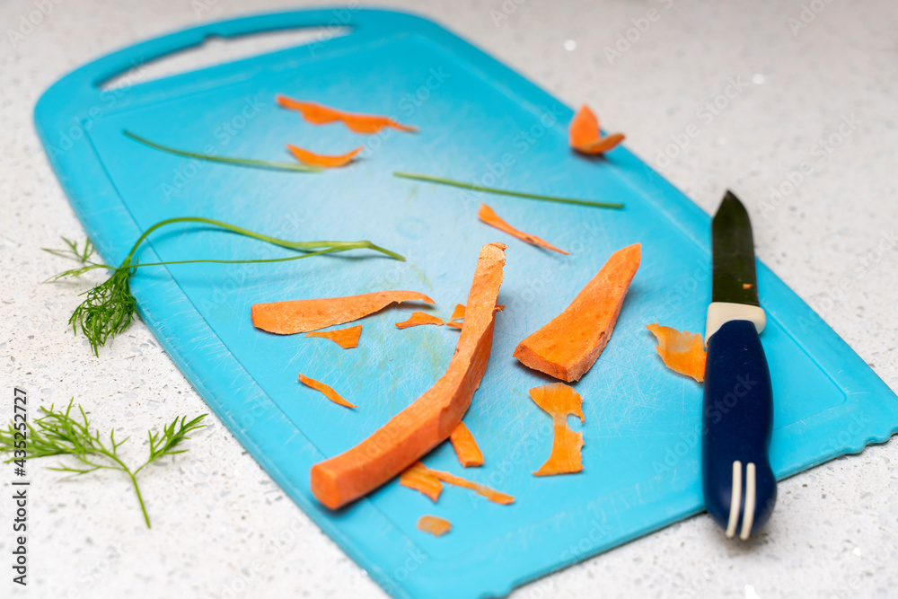 Obraz premium cutting board with leftover vegetables and a knife