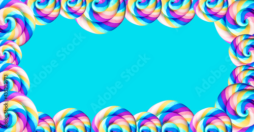 Blue summer background with rainbow candies on the edges and copy space